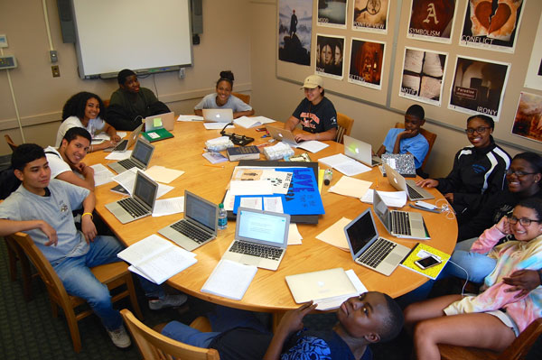 high school students sitting around a table